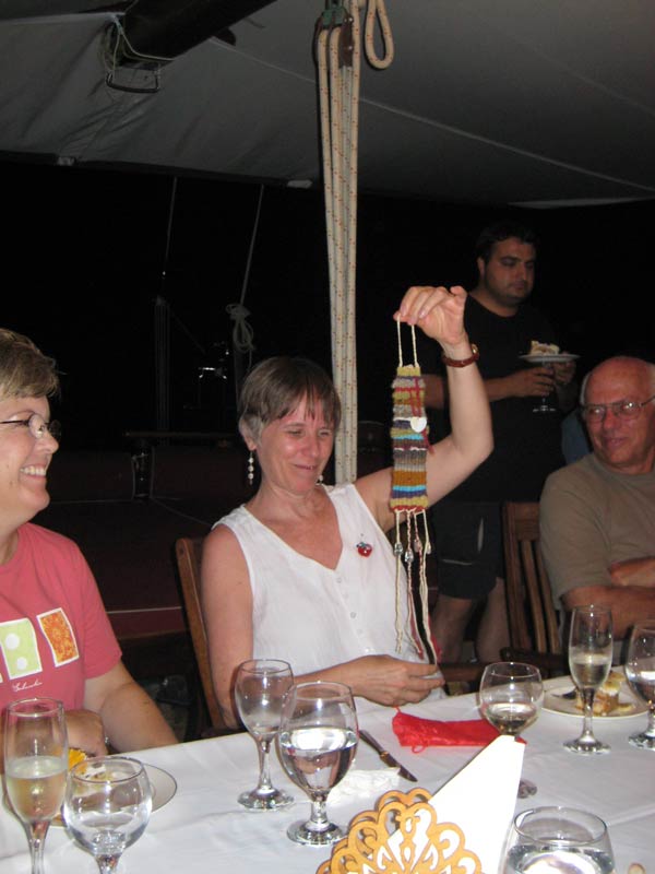 Woman receives woven gift at party