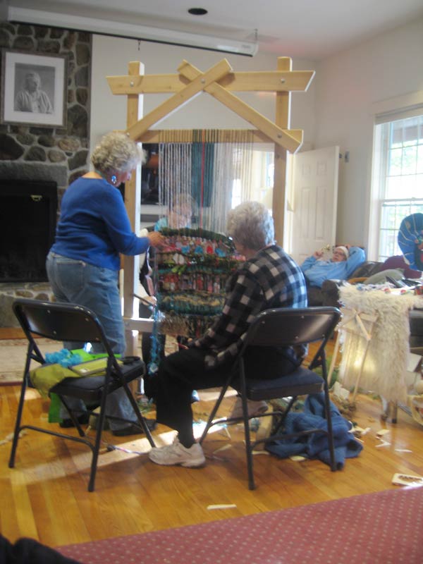 Women weaving at the Story Loom