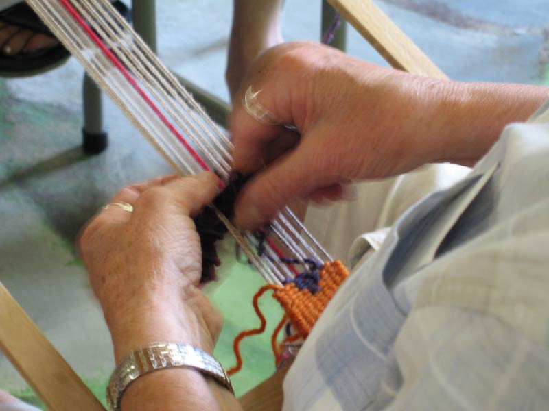 Close-up of hands weaving